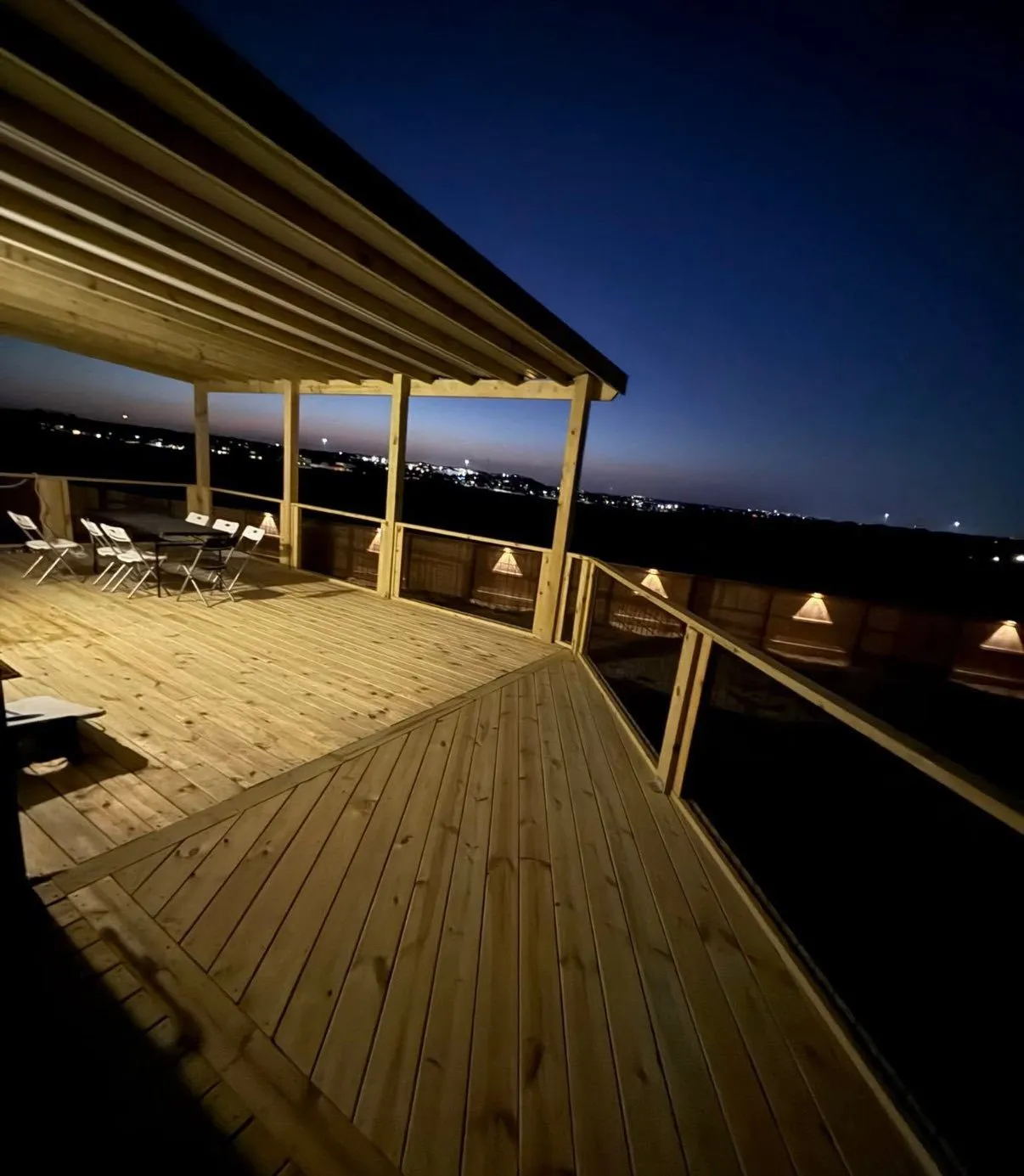 Deck under a covered roof at dusk